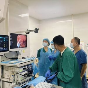 Dr Abhinav Kumar doing endoscopy in a hospital in china - CIDS Care